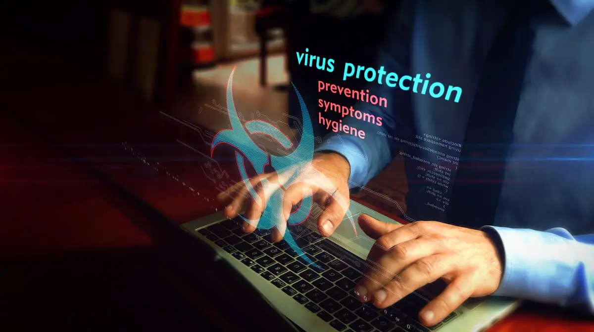 Person typing, virus protection concept displayed.